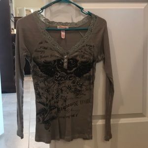 Lace-trim long sleeved top w/ rhinestone accents.